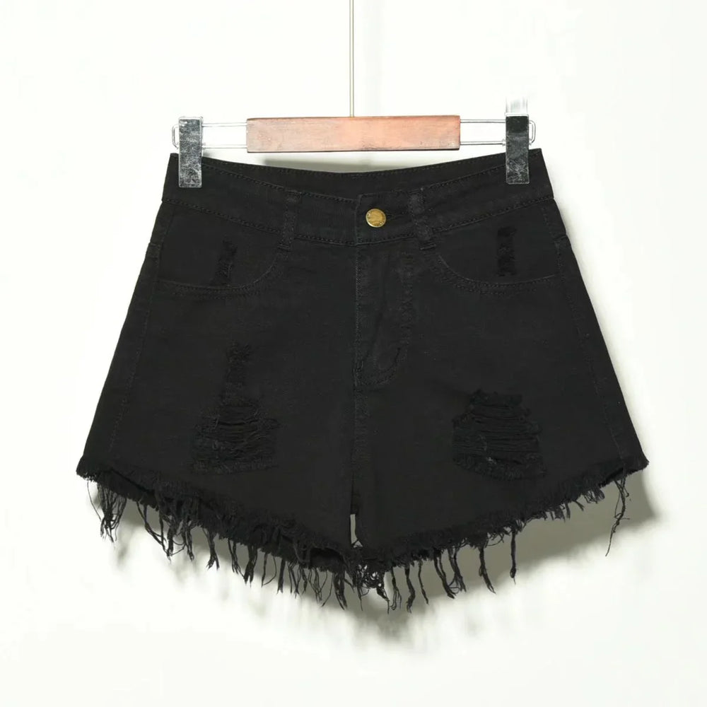 Black distressed denim shorts with frayed hem hanging on wooden hanger