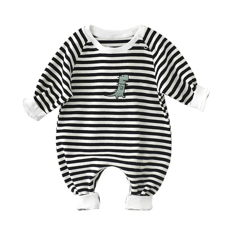 Black and white striped baby romper with green dinosaur embroidery and snap shoulder detail