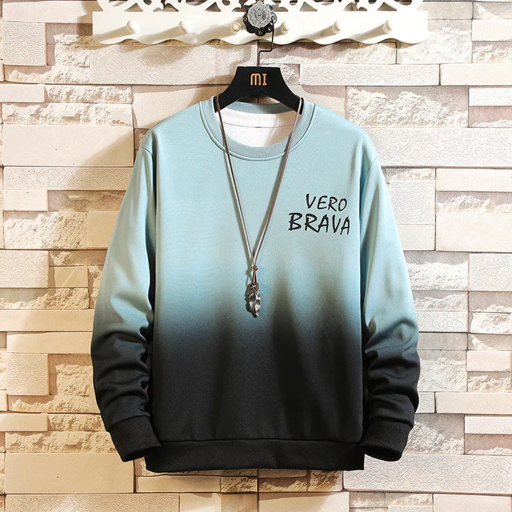 Blue to black gradient sweatshirt with VERO BRAVA text and feather pendant necklace on hanger