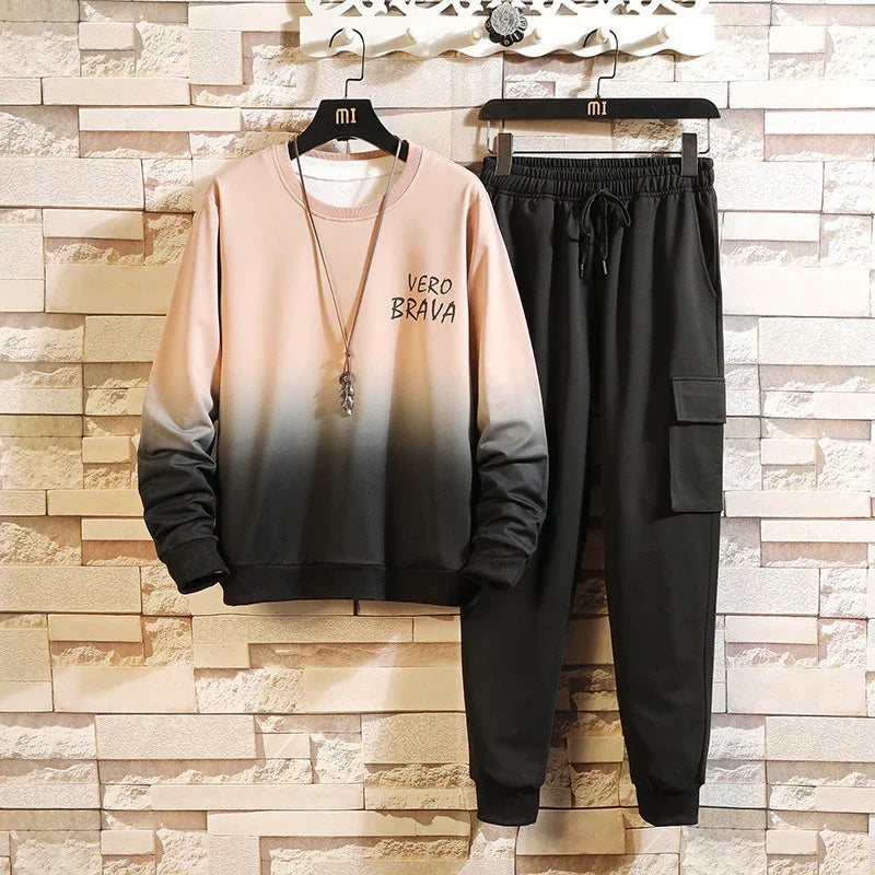 Beige to black gradient sweatshirt with Vero Brava text and black cargo jogger pants set on hangers