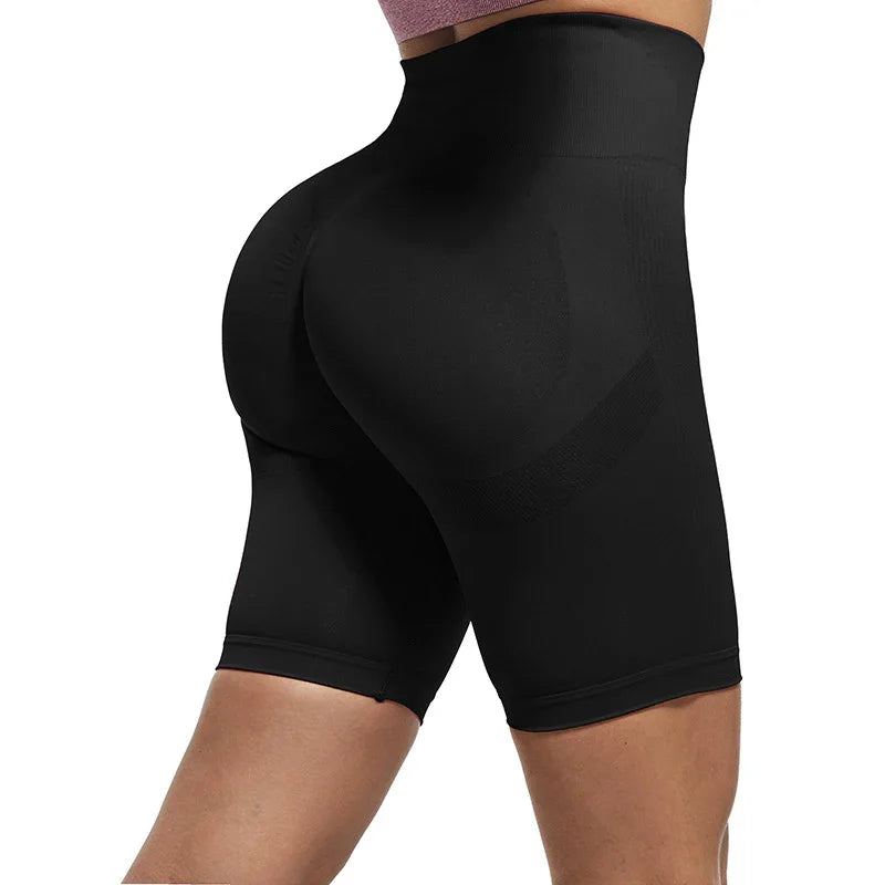 Back view of a person wearing black high-waisted shaping shorts for butt lift and thigh compression