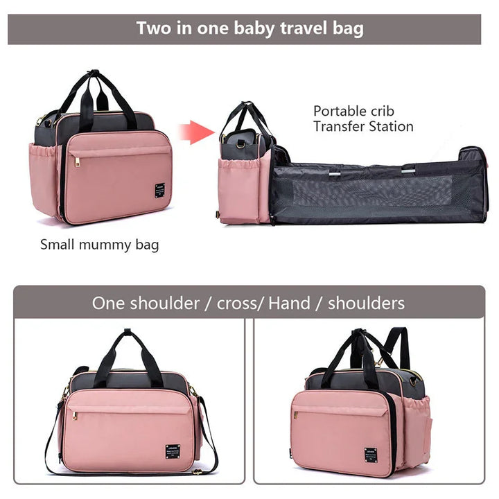 Pink two-in-one baby travel bag that converts into a portable crib transfer station with multiple carrying options