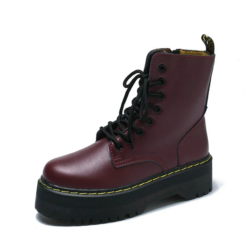 Burgundy leather platform combat boot with black laces and yellow stitching on thick sole