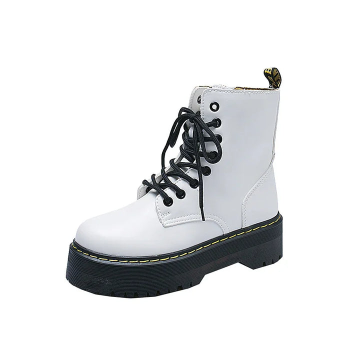White leather combat boot with black laces and thick black sole with yellow stitching