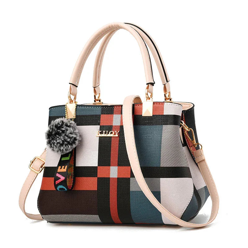 Fashionable plaid pattern handbag with beige handles, detachable strap, and furry keychain accessory