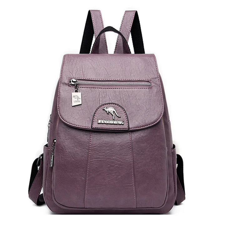 Purple leather backpack with front zip pocket and kangaroo logo on white background