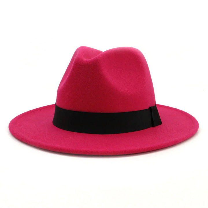 Bright pink fedora hat with a black band on a white background