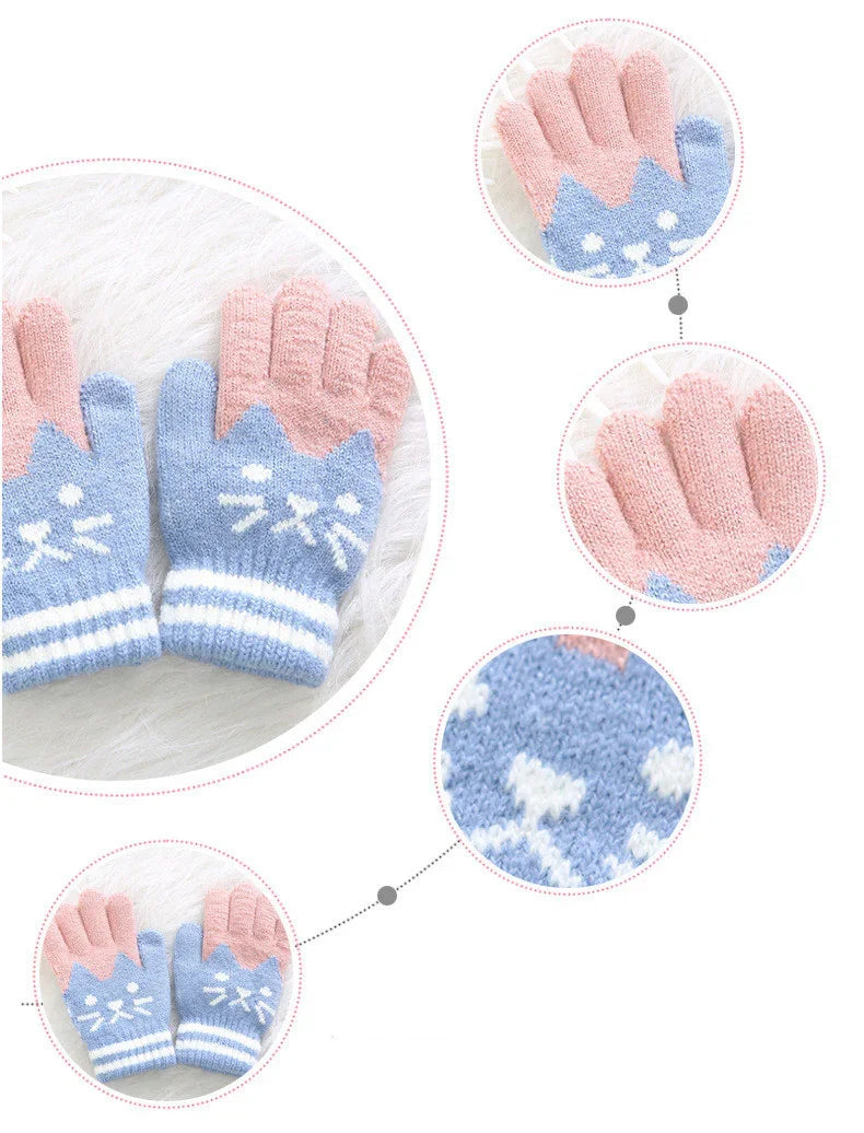 Soft knitted winter gloves with pink fingers and blue cat face design on white background