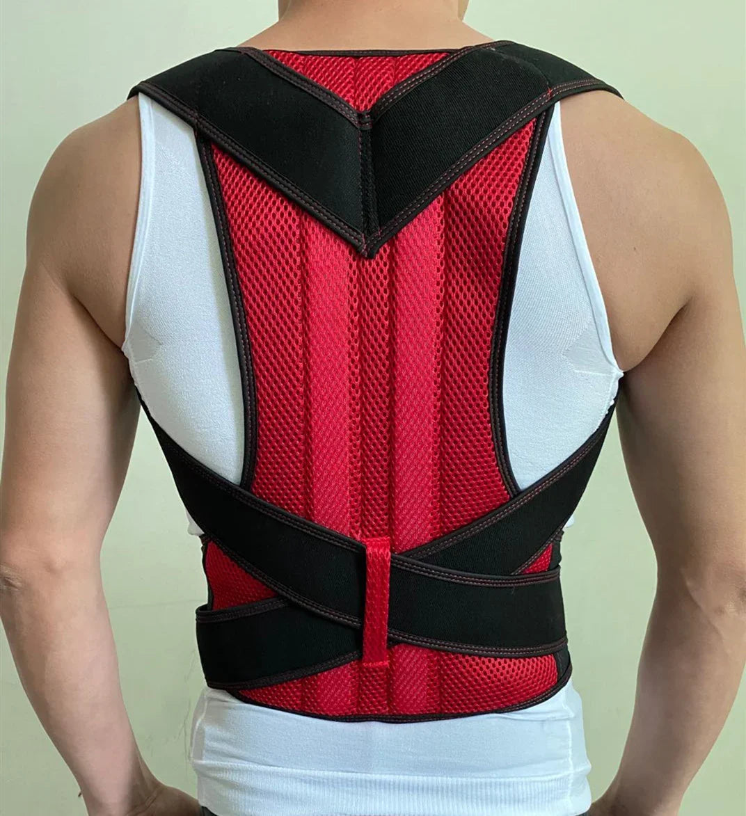Back view of a person wearing red and black posture corrector brace over white tank top