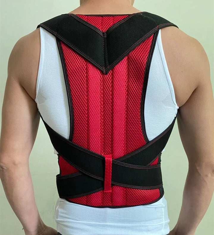 Back view of a person wearing red and black posture corrector brace over white tank top