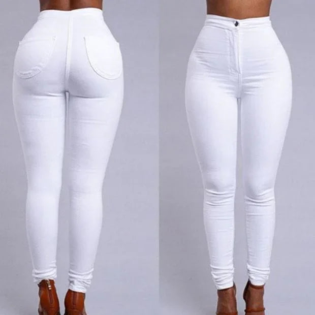 Front and back views of a woman wearing high-waisted white skinny jeans with brown heels on a gray background