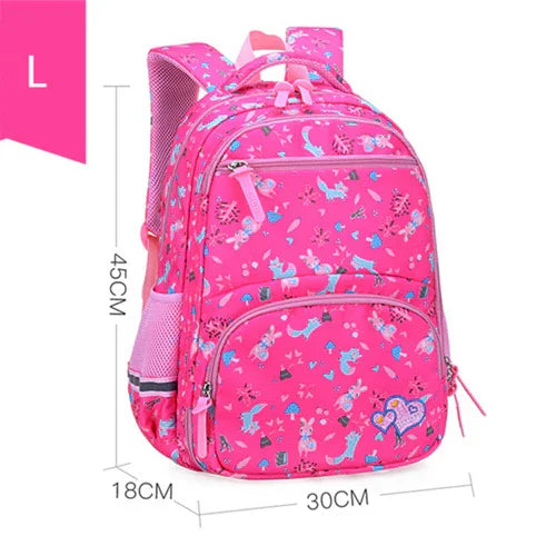 Large pink kids backpack with butterfly and flower prints, multiple compartments, and side mesh pockets