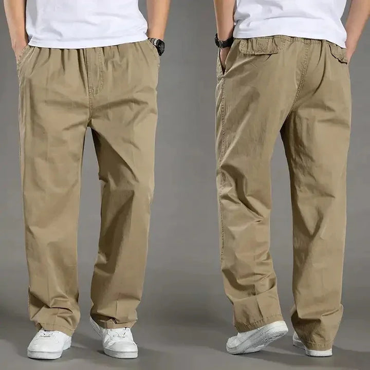 front and back view of men's casual loose-fitting khaki pants paired with white sneakers and white t-shirt