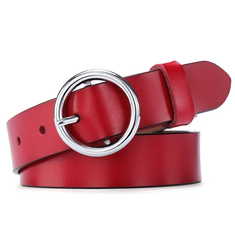 Red leather belt with round silver buckle on white background
