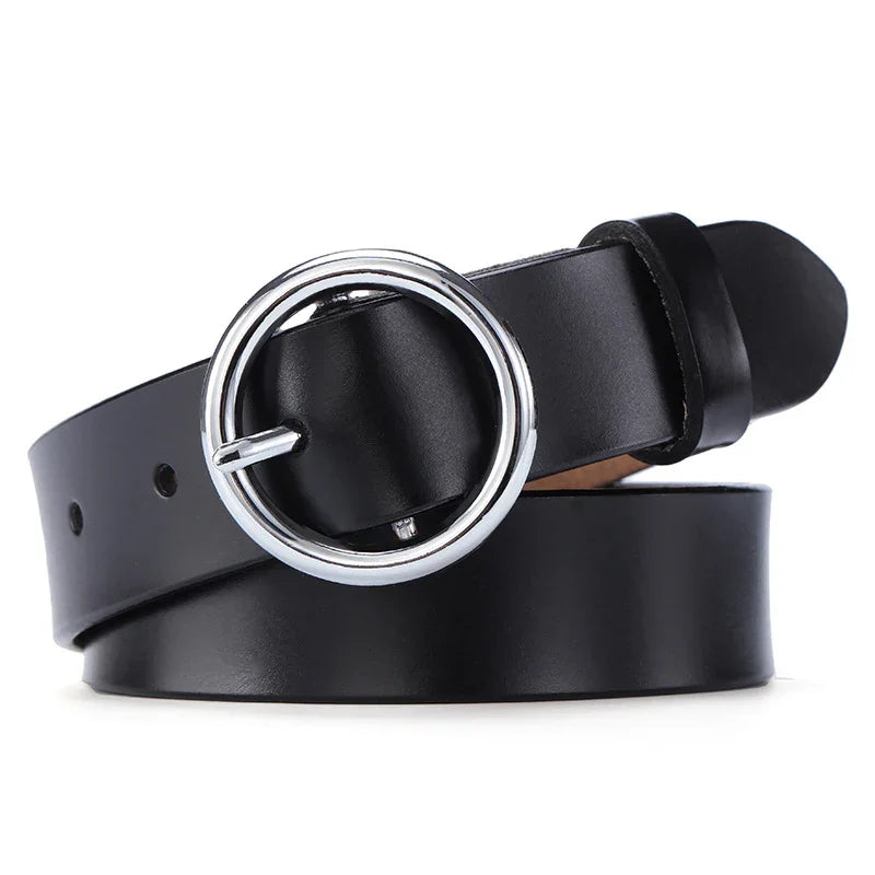 Black leather belt with shiny silver round buckle on white background