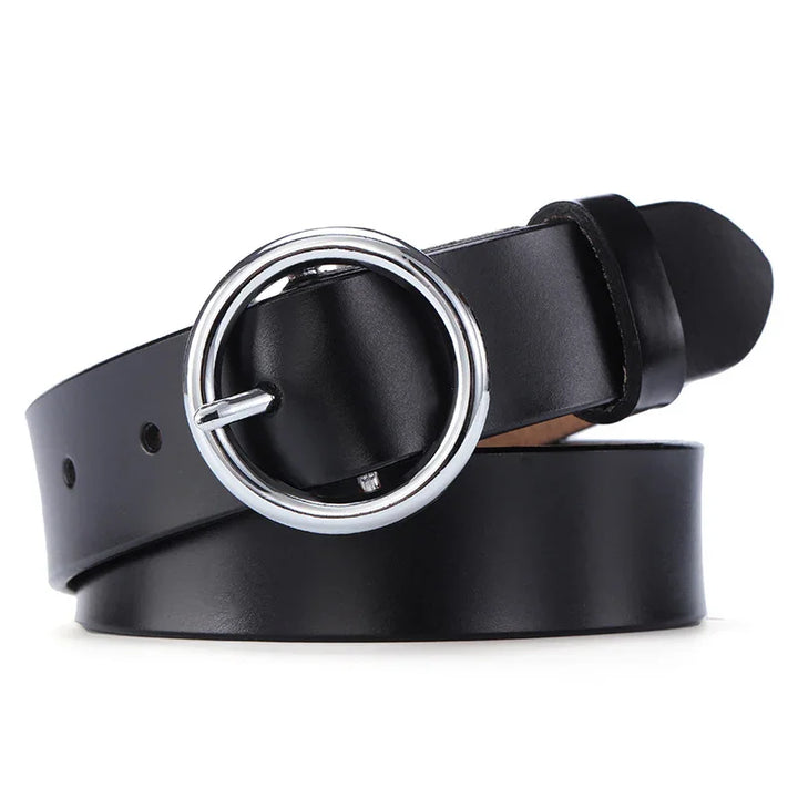 Black leather belt with shiny silver round buckle on white background
