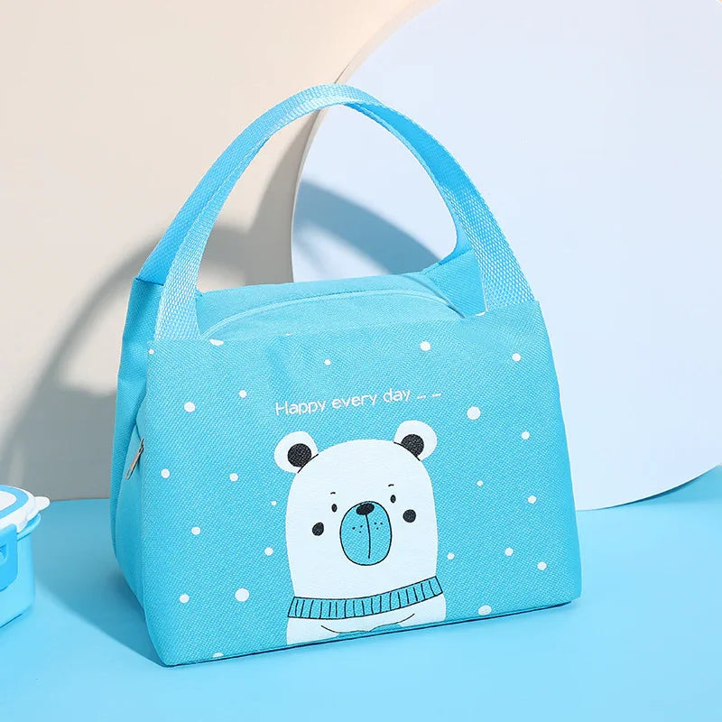 Blue insulated lunch bag with cute polar bear illustration and text, sturdy handle, winter design