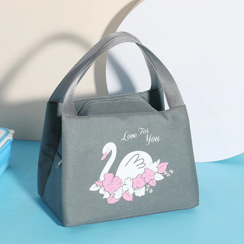 Gray lunch tote bag with top handles featuring white swan and pink flowers design and 'Love For You' text