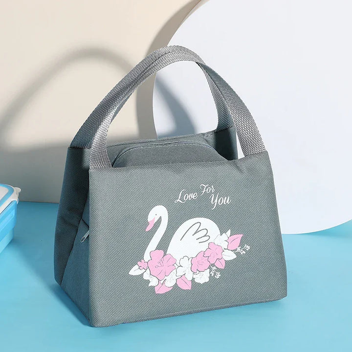 Gray lunch tote bag with top handles featuring white swan and pink flowers design and 'Love For You' text