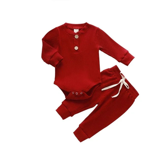 Red ribbed baby outfit with long sleeve bodysuit featuring buttons and matching pants with white drawstring