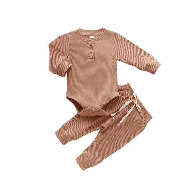 Ribbed brown long sleeve baby bodysuit and matching drawstring pants set on white background