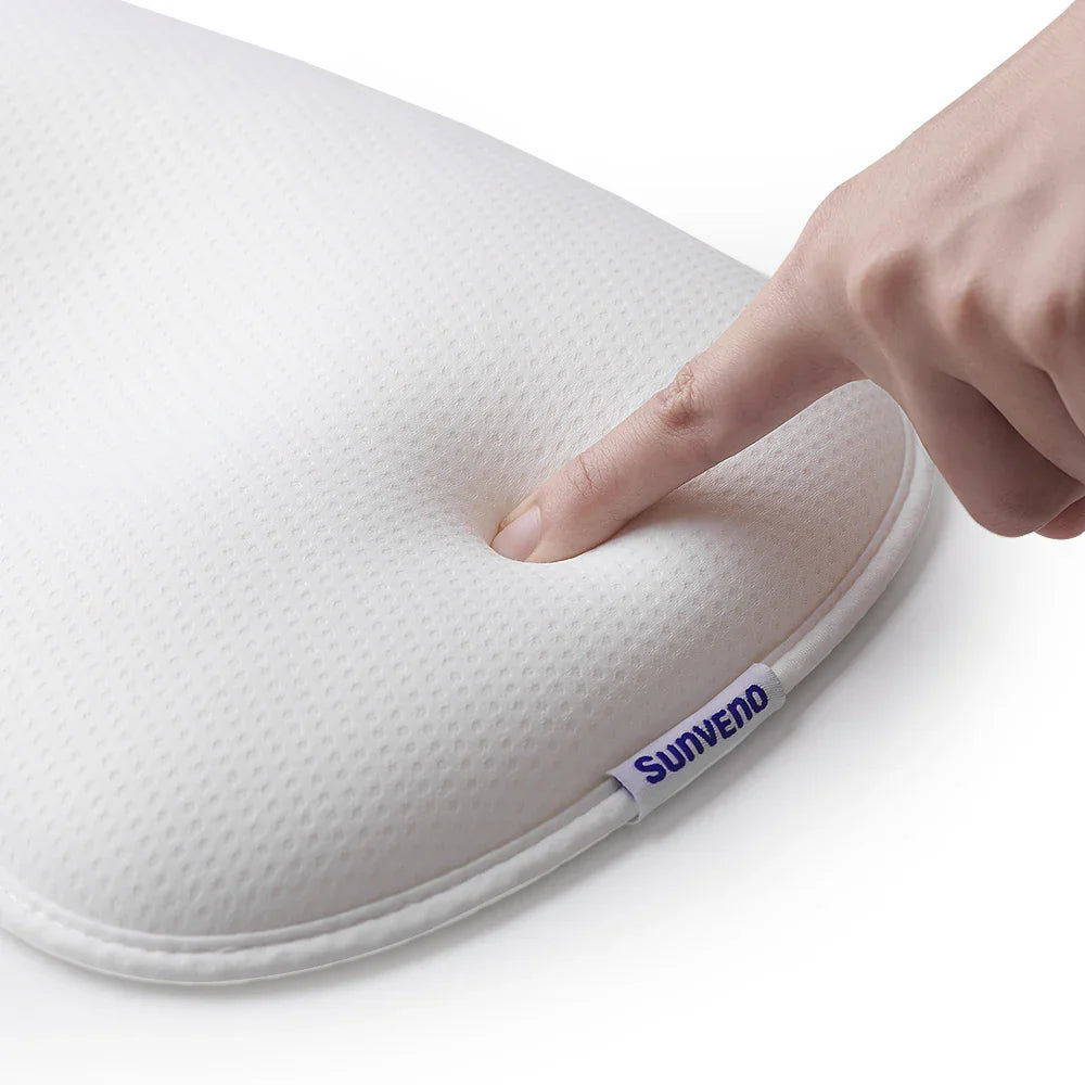 Finger pressing soft white memory foam pillow with Sunveno brand tag