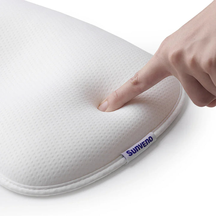 Finger pressing soft white memory foam pillow with Sunveno brand tag