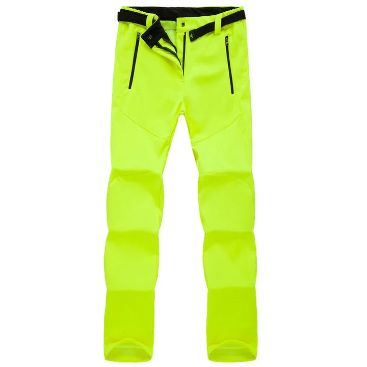 High-visibility neon yellow outdoor softshell pants with black zipper pockets and adjustable waist