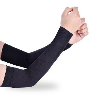 Arms wearing black compression arm sleeves on a white background