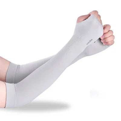 Pair of light grey sun protection arm sleeves with thumb holes worn on arms