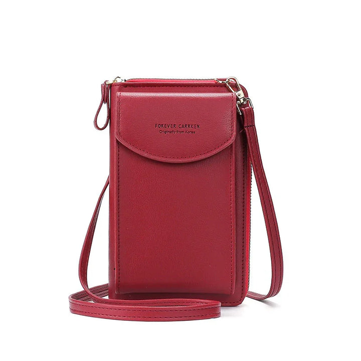 Red leather crossbody phone bag with flap pocket and adjustable strap, labeled Forever Carrken