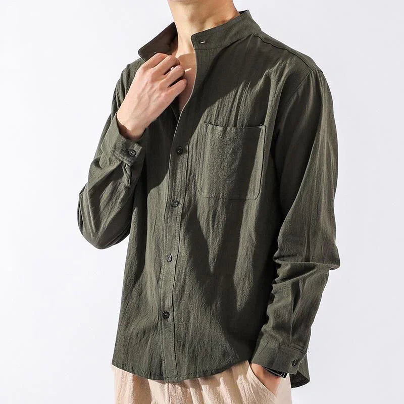 Man wearing olive green casual button-up shirt with mandarin collar and chest pocket
