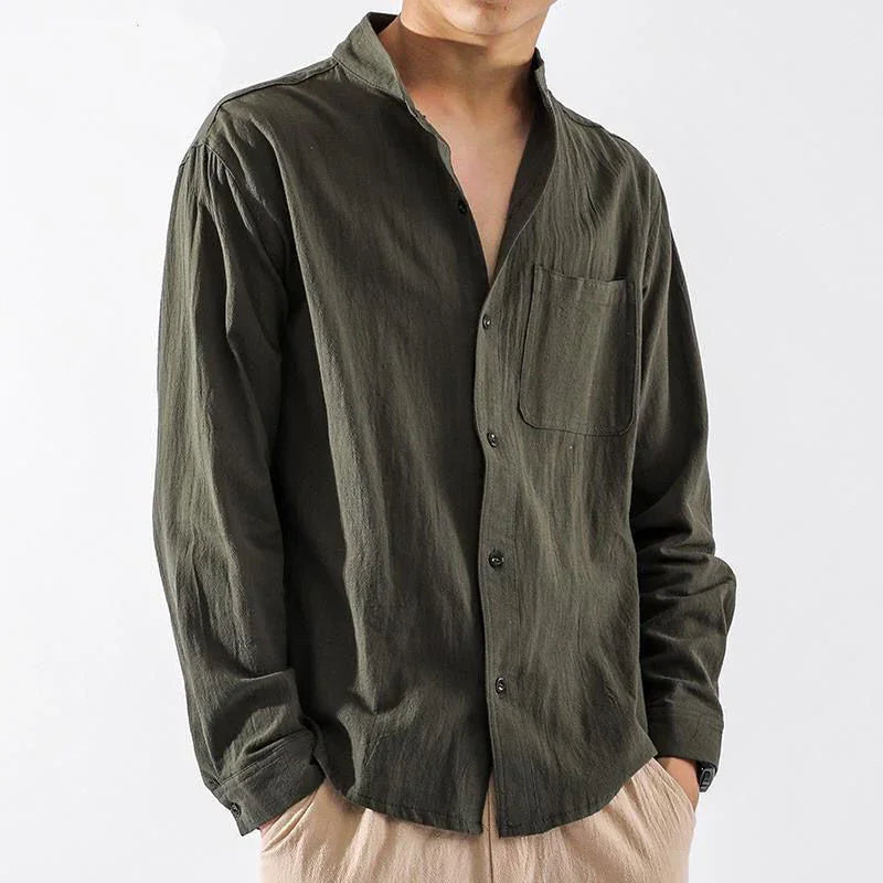man wearing olive green long-sleeve button-up shirt with chest pocket and beige pants