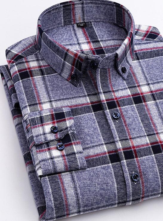 Folded men's button-down flannel shirt with blue, black, white, and red plaid pattern on white background