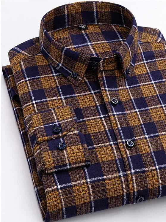 Folded men's button-up flannel shirt with navy, brown, and white plaid pattern