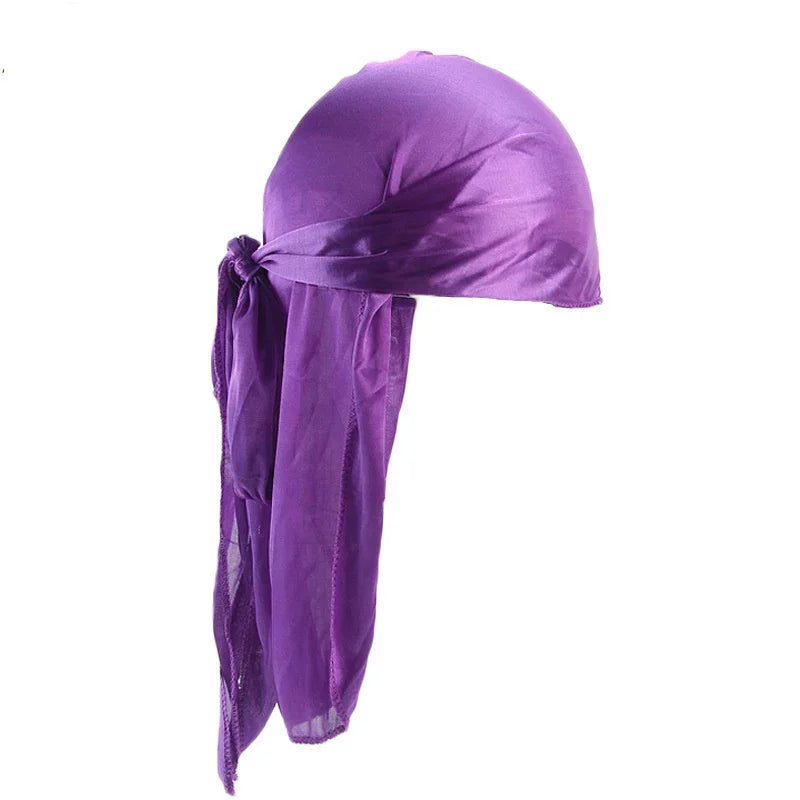 Purple silk durag with long flowing tie straps on white background
