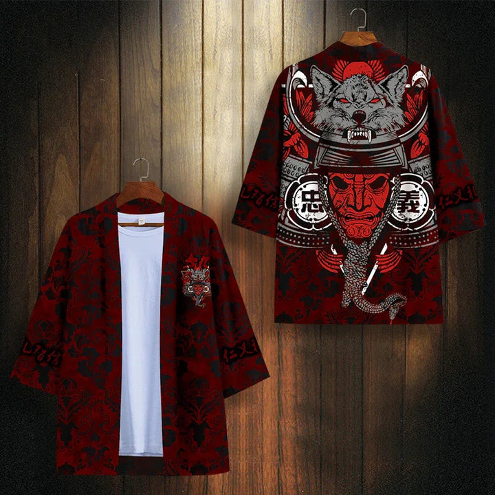 Red and black kimono jacket with wolf and samurai mask design hanging on wooden wall