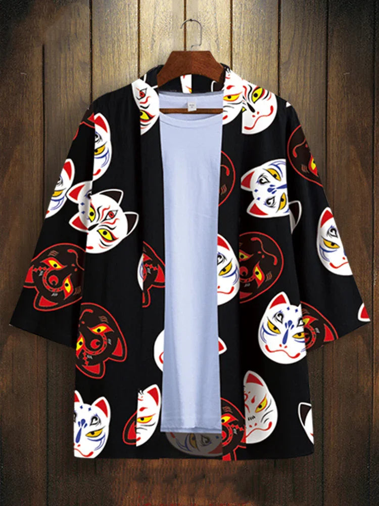Black kimono jacket with colorful Japanese fox mask prints over a plain white t-shirt on a wooden hanger