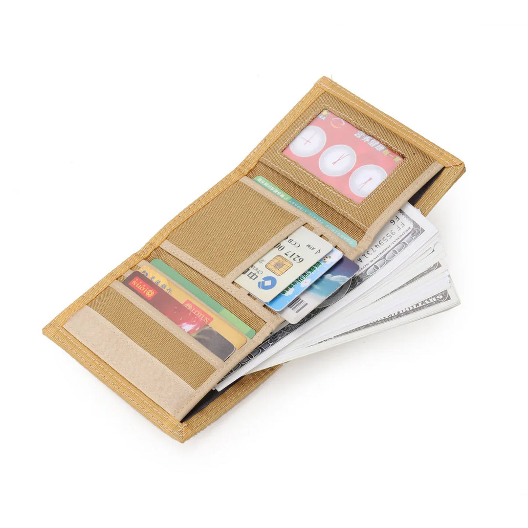 Beige fabric wallet open with multiple credit cards and stacked US dollar bills inside