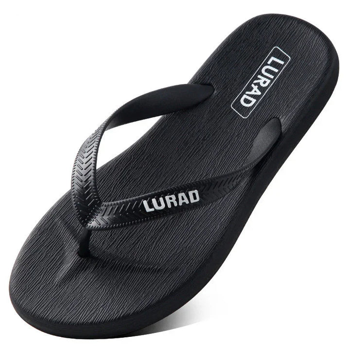 black LURAD flip flop sandal with textured footbed and logo on strap and sole