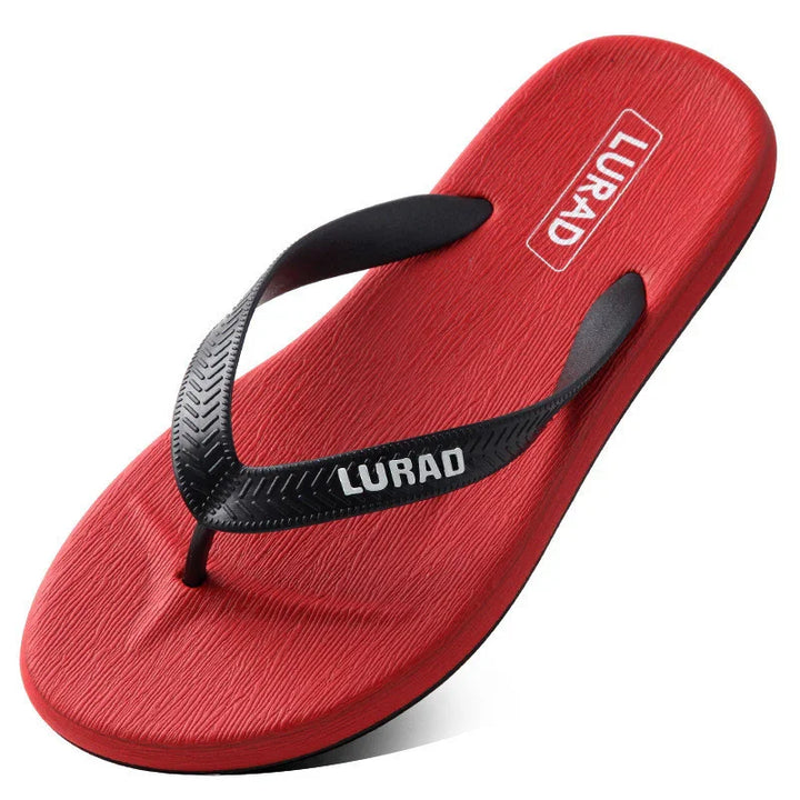 Red LURAD flip flop sandal with textured sole and black Y-shaped strap