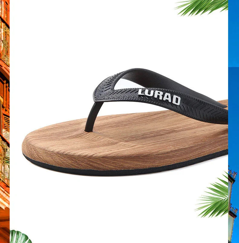 Close-up of LURAO black strap flip-flop with wood-texture footbed and black sole