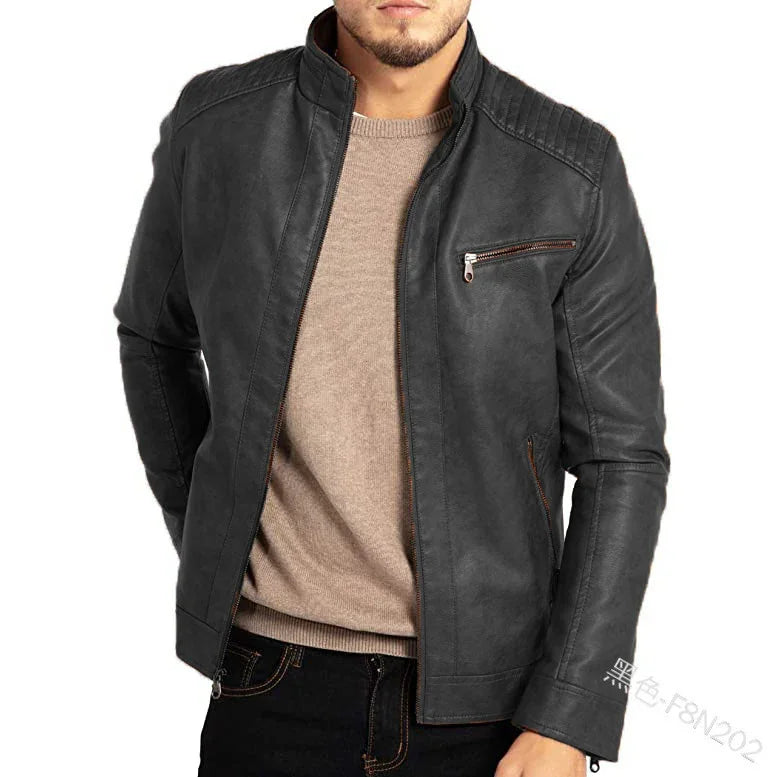Man wearing black leather biker jacket with zippered chest pocket and quilted shoulder detail