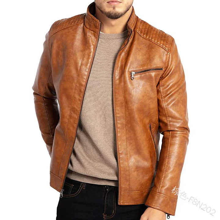 Men's brown leather biker jacket with zippered chest pocket, worn over beige sweater