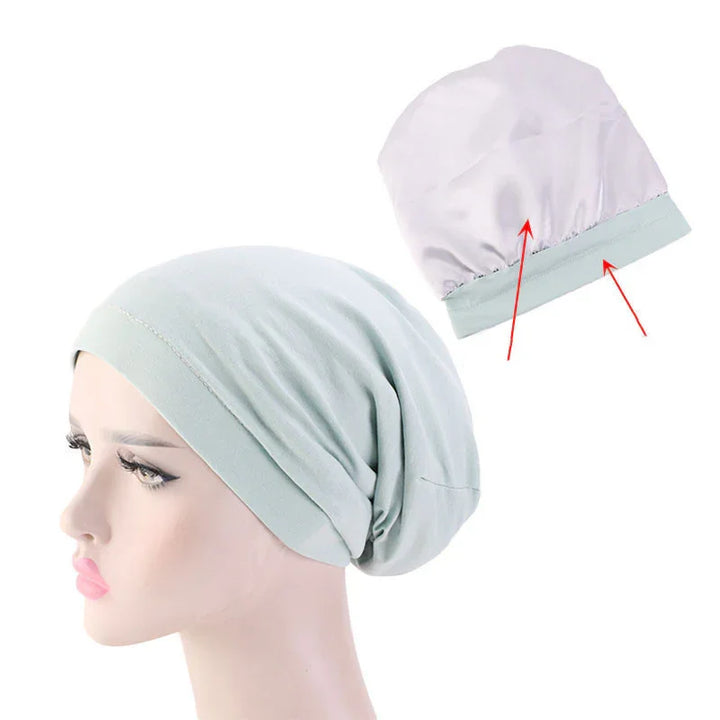 Light grey soft cotton slouchy beanie hat on mannequin head with lining detail shown