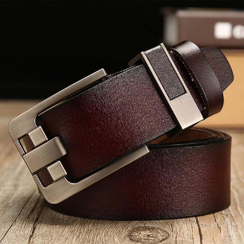Dark brown leather belt with a silver rectangular metal buckle on wooden surface