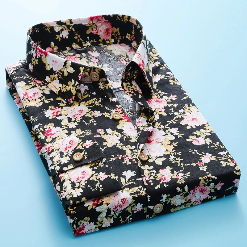 Folded black floral dress shirt with pink, white, and yellow flowers on blue background