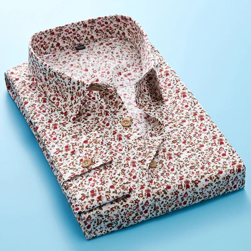 Folded white floral print shirt with red and brown flowers on blue background