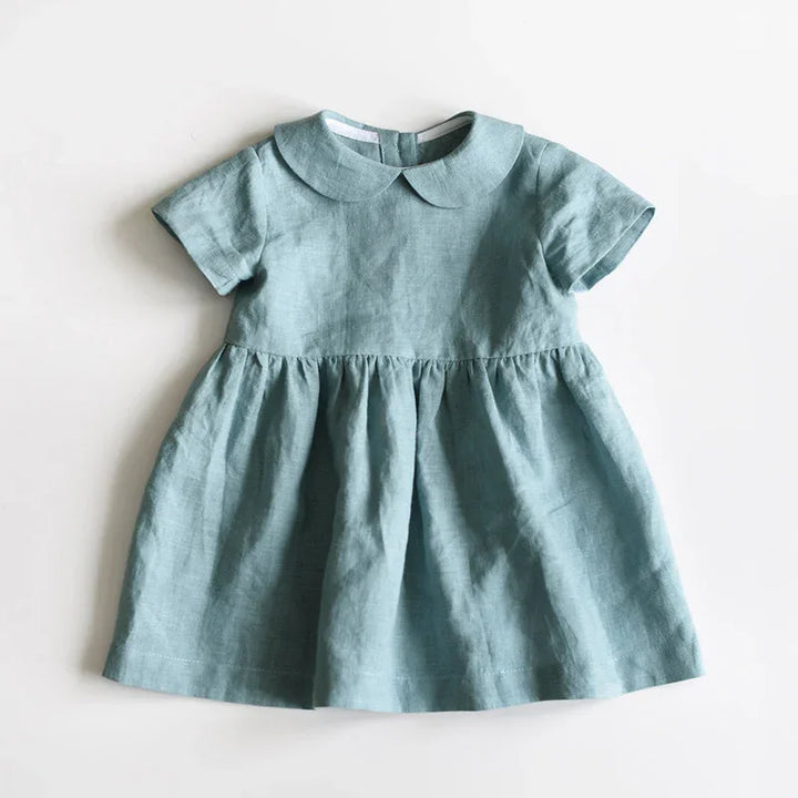 Light blue short-sleeve baby dress with Peter Pan collar and gathered skirt on white background