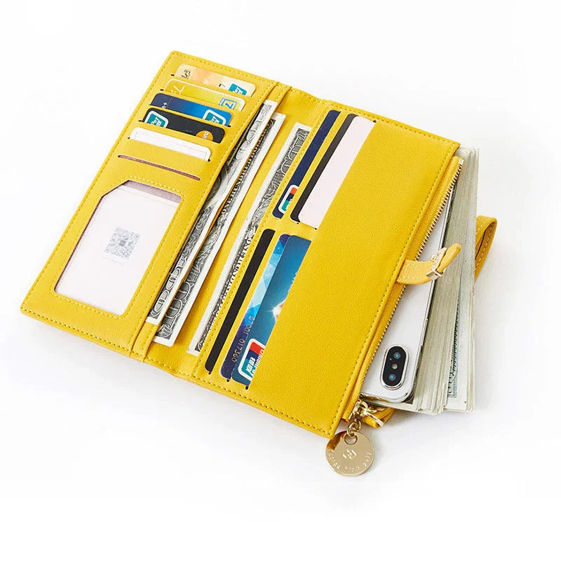Open yellow leather wallet organizer with credit cards, cash, and a smartphone pocket on white background